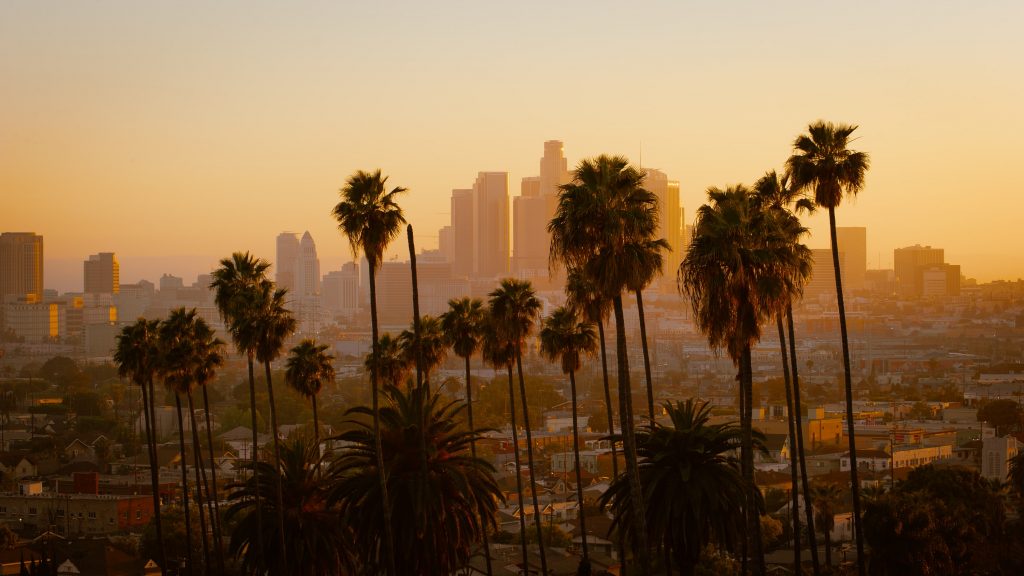 The sun rises over downtown Los Angeles.